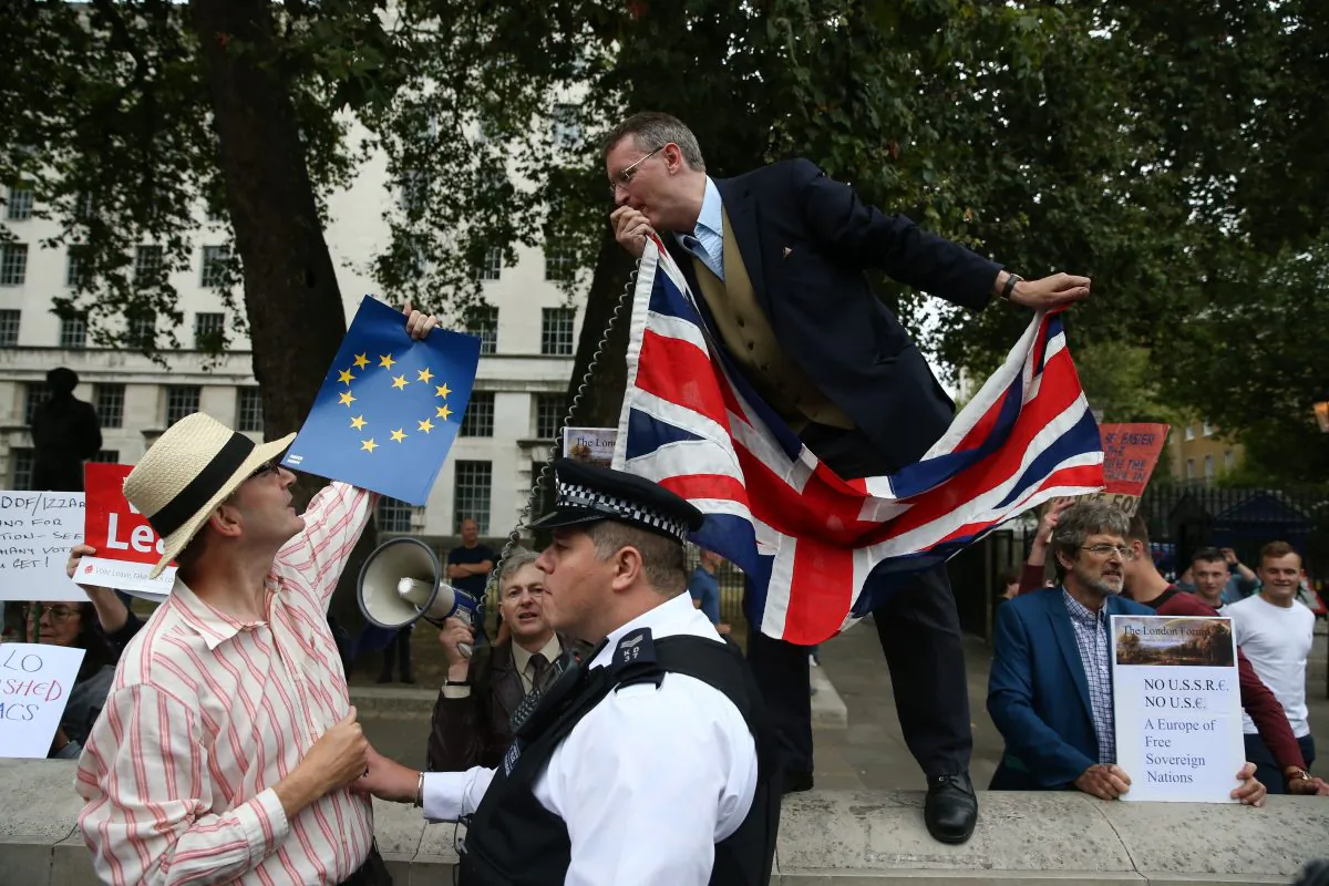 A  police  officer  separates  an  anti-Brexit  demonstrator  from  a  pro-Brexit  demonstrator  in  Parliament  Square  on  September  3rd,  2016.  
The prospect of a ‘hard Brexit’ – an all-out exit from the European Union – is looking likely, business leaders say. (JUSTIN TALLIS/AFP/Getty Images)