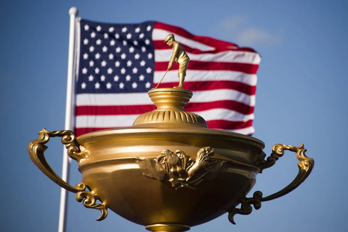 The American flag flies behind a statue of the Ryder Cup trophy at Hazeltine National Golf Course in Chaska, Minnesota. (Jim Watson/AFP/Getty Images)