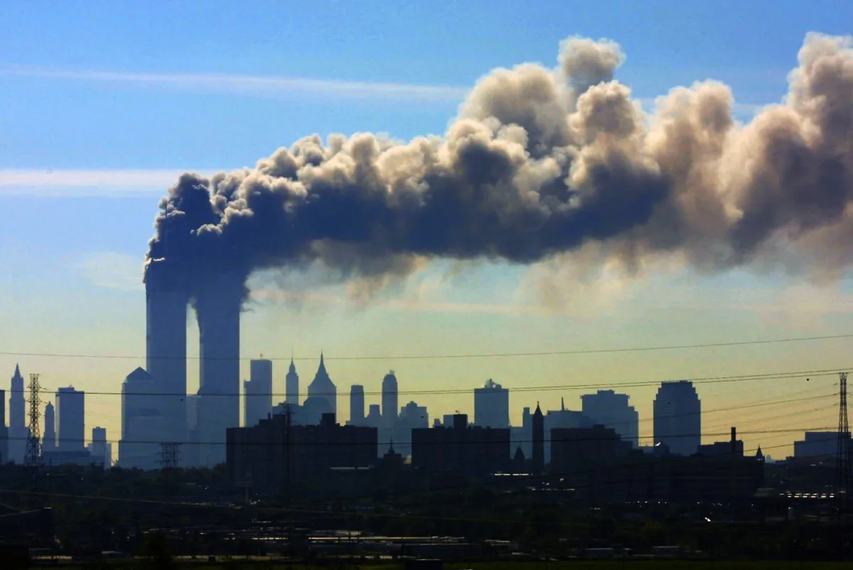 Smoke billows from the twin towers of the World Trade Center in New York
on Sept. 11, 2001.
Saudi Arabia and its allies are warning that legislation allowing the kingdom to be sued for the 9/11 attacks will have negative repercussions. (AP Photo/Gene Boyars)