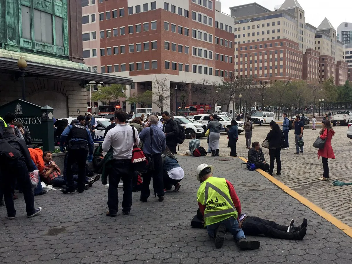 People are treated for their injuries outside after a NJ Transit train crashed in to the platform at Hoboken Terminal in on Sept. 29 New Jersey. (Pancho Bernasconi/Getty Images)