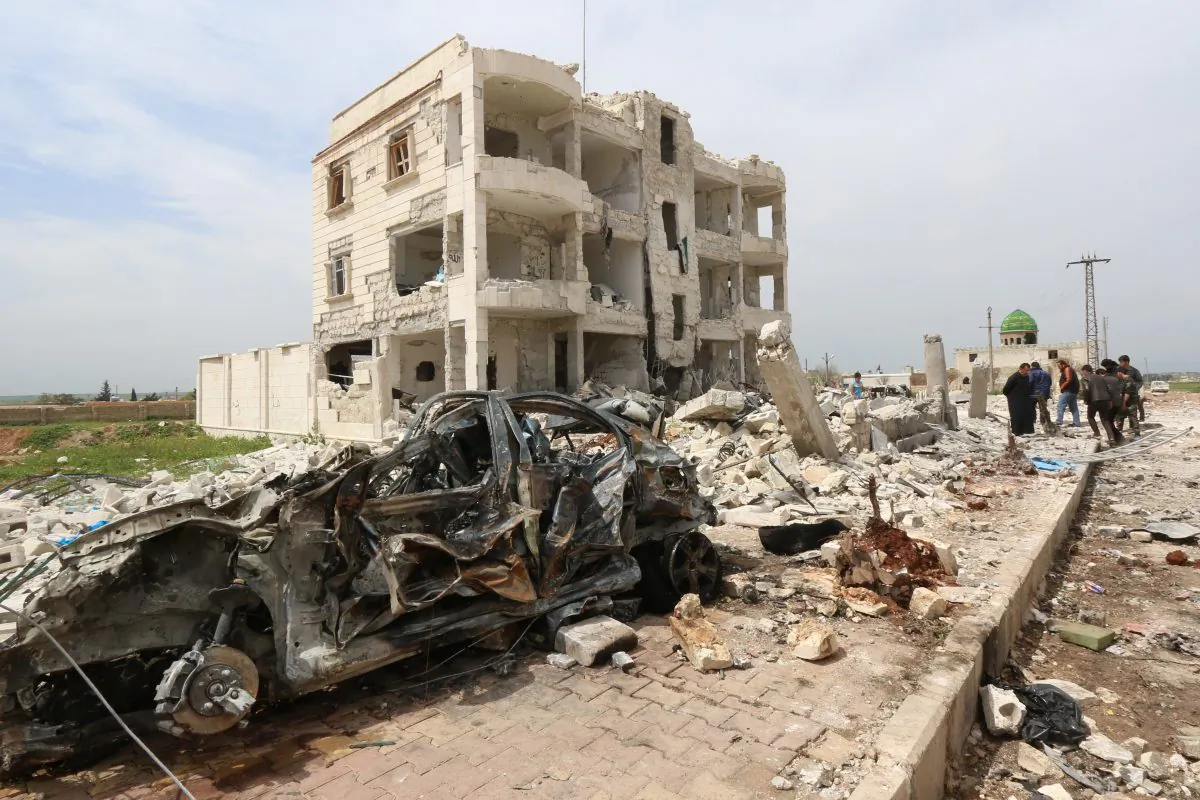 Syrians walk through the rubble following an alleged bombing by the Islamic State in Marea, northern Aleppo, on April 8, 2015. (Zein al-Rifai/AFP/Getty Images)
