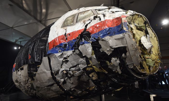 The wrecked cockipt of the Malaysia Airlines Flight MH17 is presented to the press during a presentation of the final report on the cause of the its crash at the Gilze Rijen Airbase on Oct. 13, 2015. (Emmanuel Dunand/AFP/Getty Images)