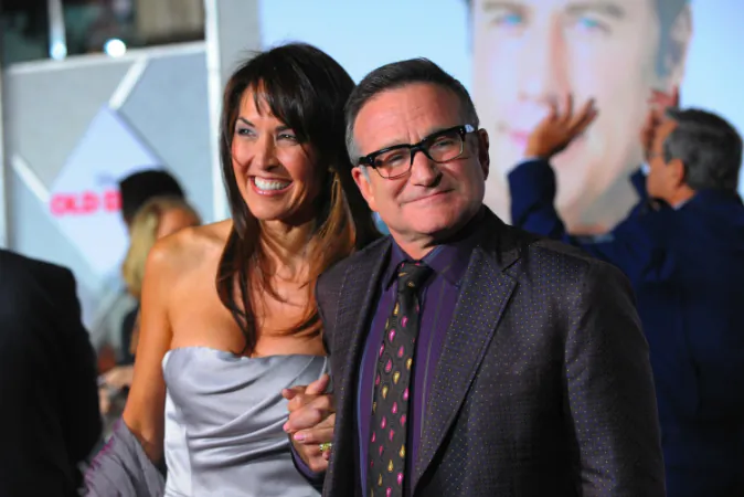  Actor Robin Williams (R) and Susan Schneider arrive at the premiere of Walt Disney Pictures' 'Old Dogs' at the El Capitan Theatre on November 9, 2009 in Hollywood, California. Schneider penned an essay detailing Williams's final moments. (Jason Merritt/Getty Images)