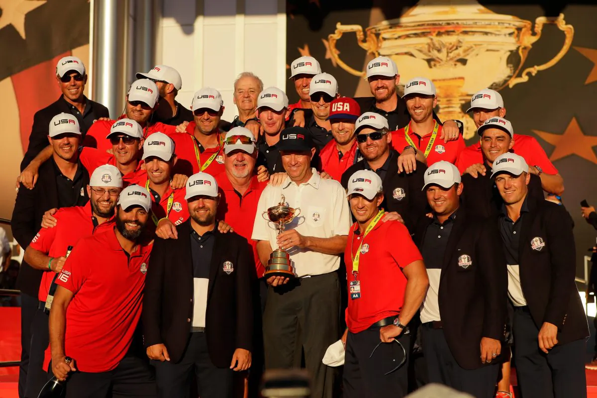 Captain Davis Love III of the United States celebrates with his team and their caddies during the closing ceremony of the 2016 Ryder Cup at Hazeltine National Golf Club on October 2. (Jamie Squire/Getty Images)