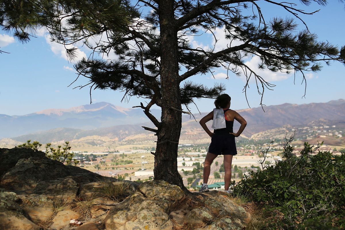 A jogger looks out over the neighborhood in Colorado Springs, Colorado on on July 01, 2012. (Photo by Spencer Platt/Getty Images)