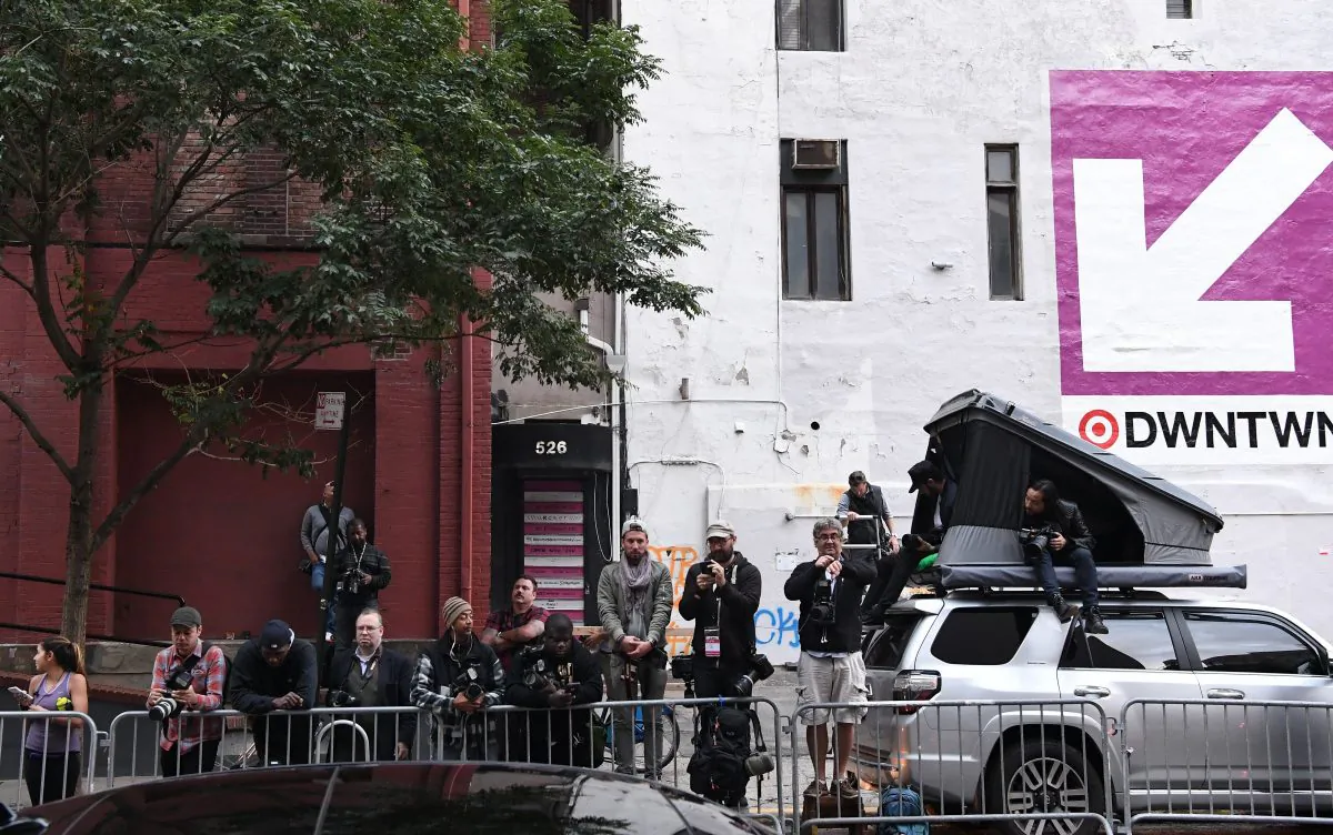 Paparazzi camp outside Kanye West and Kim Kardashian's apartment in New York on October 4, 2016.
Kim Kardashian freed herself and raised the alarm after being tied up and robbed at gunpoint in Paris of  USD 10 million in jewels in Paris, police sources said. The mother of two and wife of rap superstar Kanye West flew home to the US on Monday after being questioned by police over the incident, which a spokeswoman said had left her "badly shaken". / AFP / Angela WEISS        (Photo credit should read ANGELA WEISS/AFP/Getty Images)