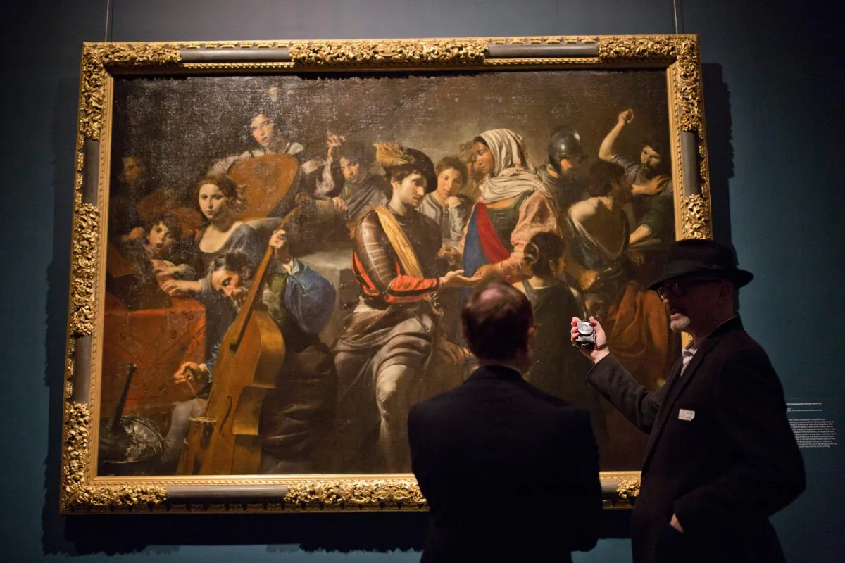 Visitors preview an exhibit of French painter Valentin de Boulogne at the Metropolitan Museum, October 5, 2016, in New York. (DOMINICK REUTER/AFP/Getty Images)