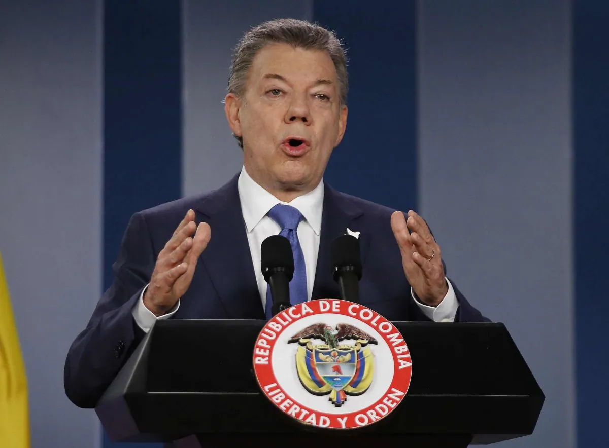 FILE - In this Wednesday, Oct. 4, 2016 file photo Colombia’s President Juan Manuel Santos delivers a statement to the press after meeting with former President Alvaro Uribe and other opposition leaders at the presidential palace in Bogota, Colombia. Colombian President Juan Manuel Santos has won Nobel Peace Prize it was announced on Friday Oct. 7, 2016. (AP Photo/Fernando Vergara, File)