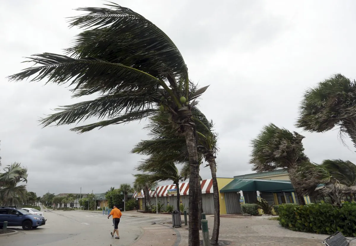 Palm trees sway in high gusts of wind in Vero Beach, FL., on Oct. 6, 2016. (AP Photo/Lynne Sladky)