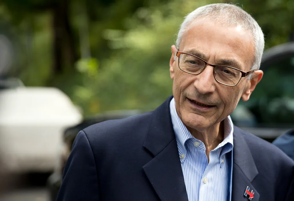 Hillary Clinton campaign chairman John Podesta speaks to reporters outside Clinton's home in Washington on Oct. 5, 2016. (AP Photo/Andrew Harnik)