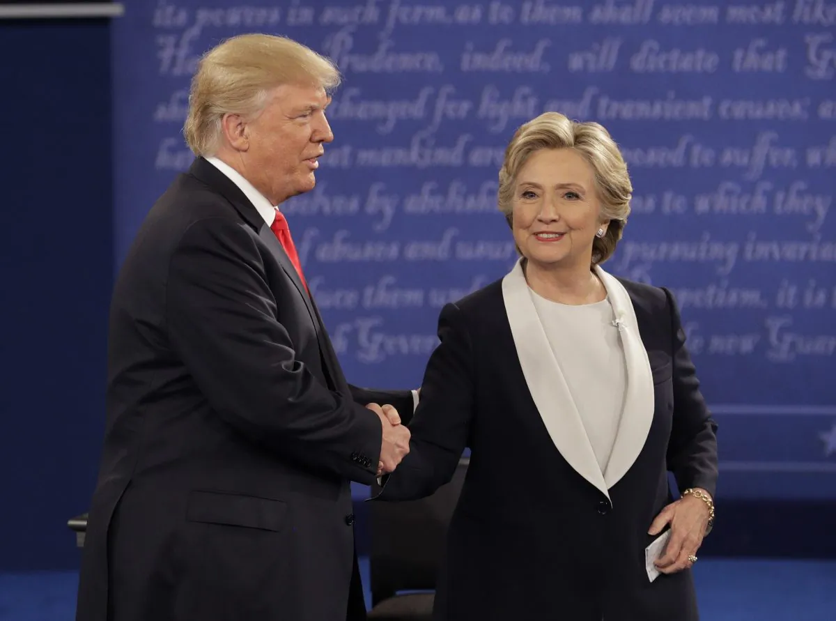Republican presidential nominee Donald Trump shakes hands with Democratic presidential nominee Hillary Clinton during the second presidential debate at Washington University in St. Louis on Oct. 9, 2016. (John Locher/AP Photo)
