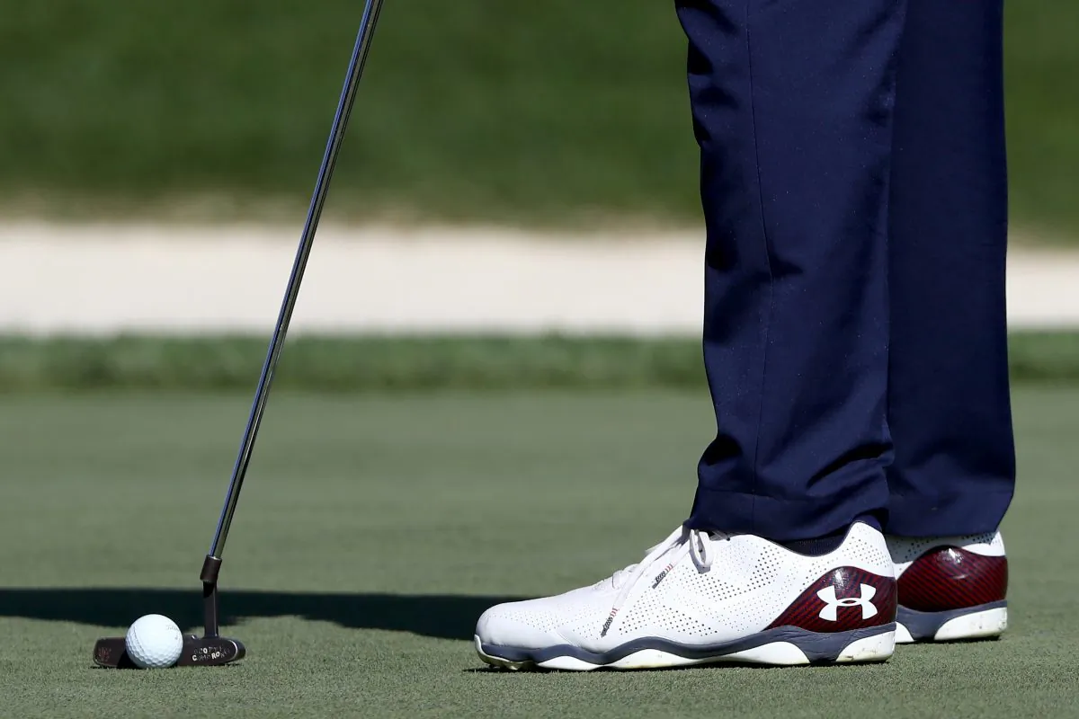 Golfer Jordan Spieth of the United States wears sponsored Under Armour shoes as he putts during practice prior to the 2016 Ryder Cup in Chaska, Minnesota. (Sam Greenwood/Getty Images)