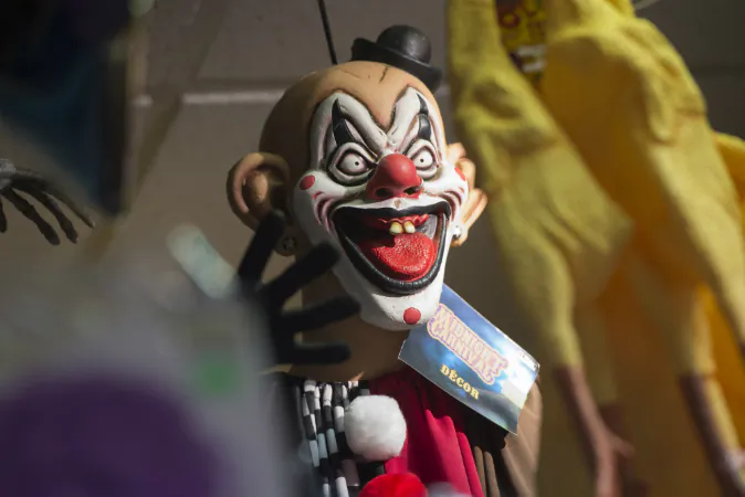 Halloween costumes and props, including a 'scary' clown mask, are seen for sale at Total Party, a party store, in Arlington, Virginia, October 7, 2016. Clown sightings have been reported in England, Australia, and Canada. (SAUL LOEB/AFP/Getty Images)
