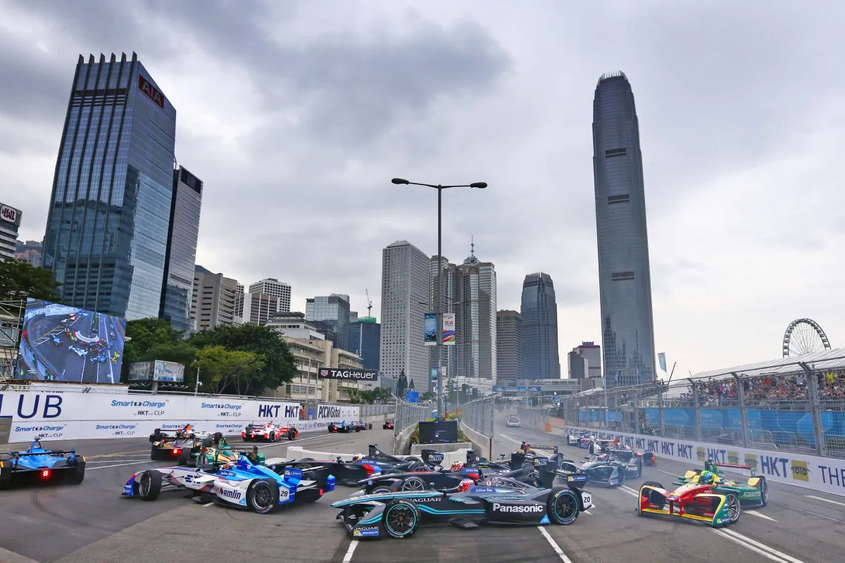 Cars including Jaguar Racings, Mitch Evans round the hairpin bend before the straight in the early stages of the inaugural Hong Kong ePrix at Victoria Harbour waterfront, the opening race of the 2016 Formula E on Sunday Oct 9, 2016. (Zak Mauger/LAT Photographic/Jaguar Racing via Getty Images)