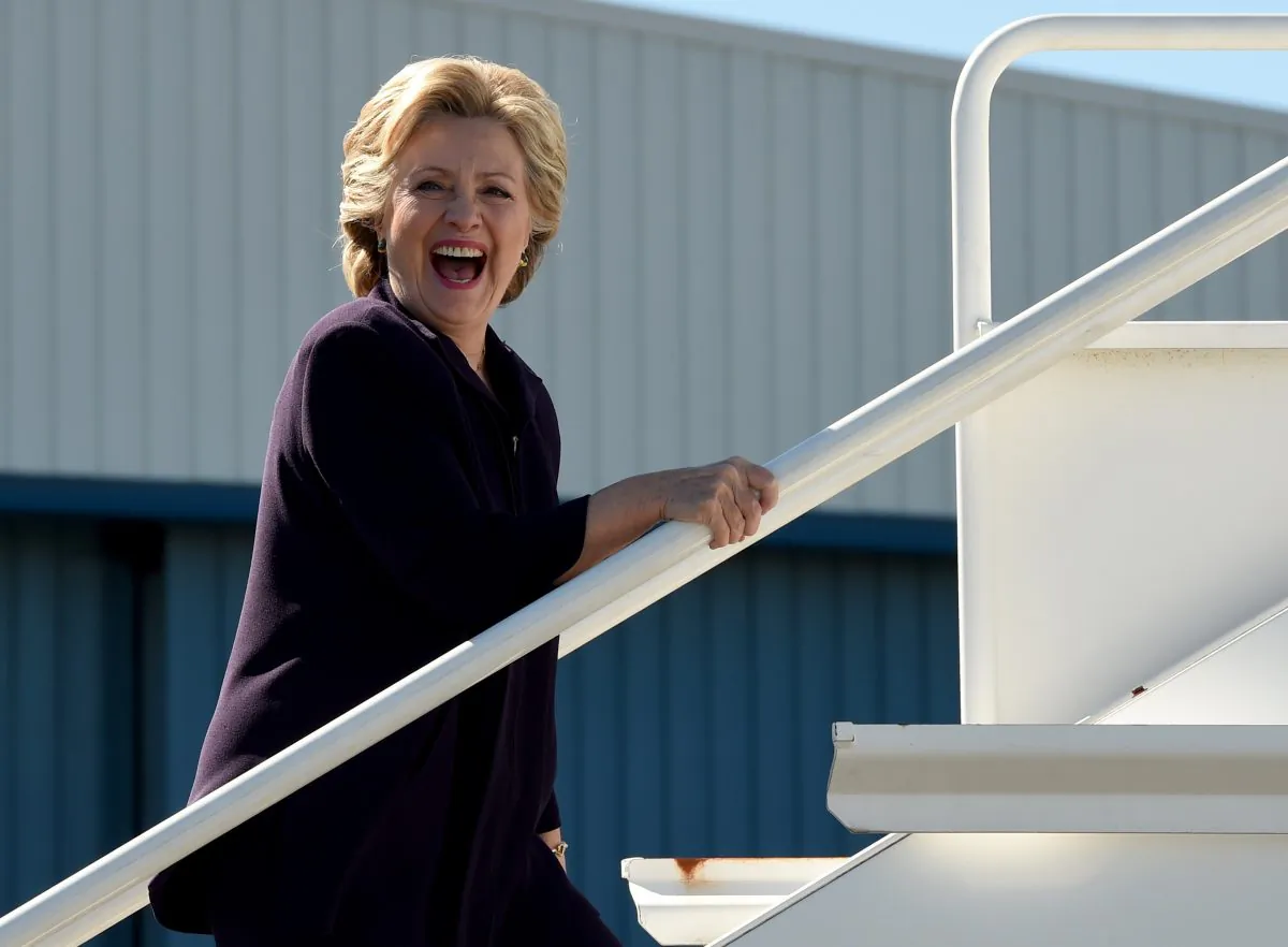 Democrat presidential nominee Hillary Clinton boards her campaign plane in White Plains, New York October 10, 2016. (Timothy A. Clary/AFP/Getty Images)