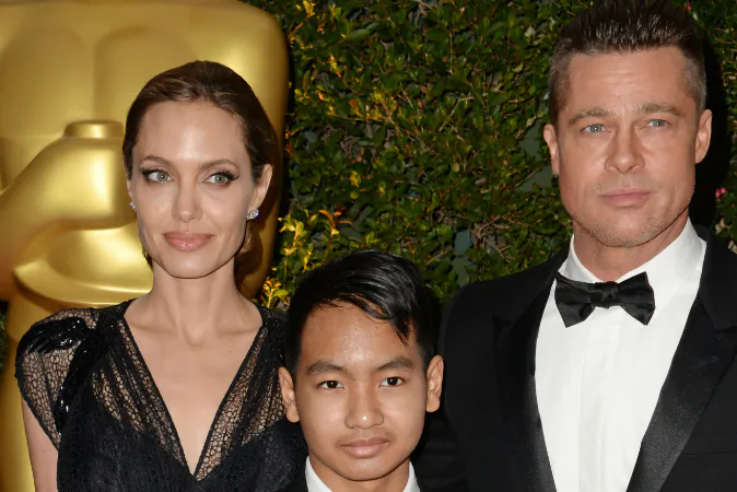 Actress Angelina Jolie, Maddox Jolie-Pitt (C) and actor Brad Pitt arrive for the 2013 Governors Awards, presented by the American Academy of Motion Picture Arts and Sciences (AMPAS), at the Grand Ballroom of the Hollywood and Highland Center in Hollywood, CA., on Nov. 16, 2013. (ROBYN BECK/AFP/Getty Images)