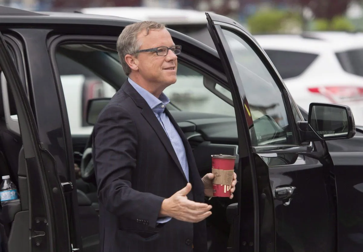 Saskatchewan Premier Brad Wall arrives for a meeting of provincial premiers in Whitehorse, Yukon, July 21, 2016. Wall says Prime Minister Justin Trudeau should look south of the border before implementing a carbon tax in Canada. (The Canadian Press/Jonathan Hayward)