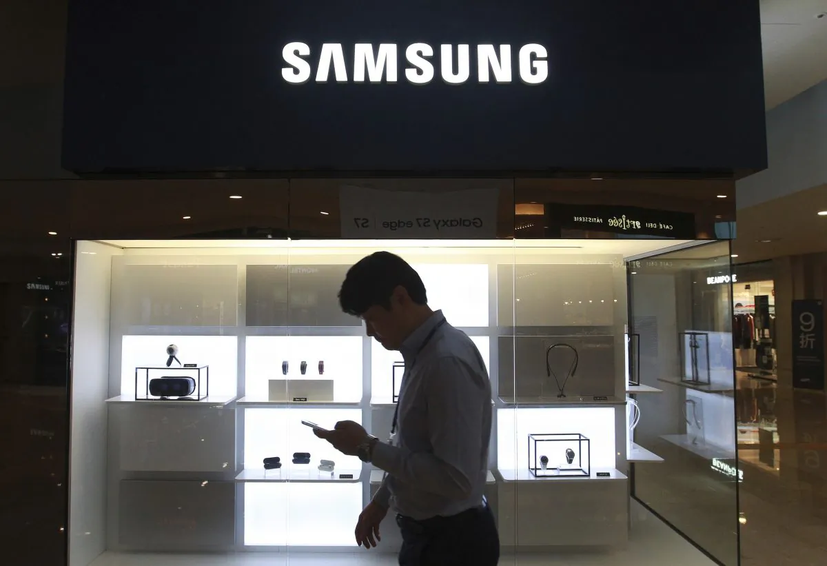 A man passes by a Samsung Electronics shop in Seoul, South Korea, on Oct. 12, 2016. (Ahn Young-joon/AP Photo)