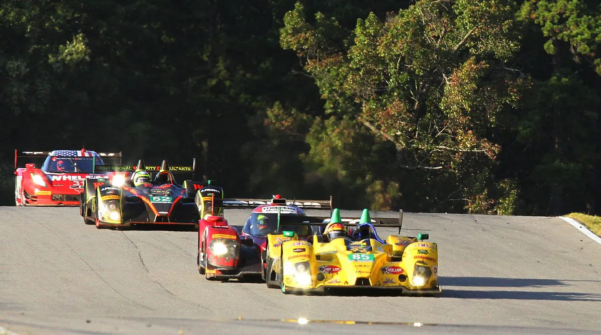 The #85 JCD-Miller Oreca leads the #70 Mazda Prototype, the #52 PR1-Mathiesen Oreca, and the #31 AXR Coyote-Corvette over the crest after Turn Five halfway through the 2016 Petit Le Mans. (Chris Jasurek/Epoch Times)