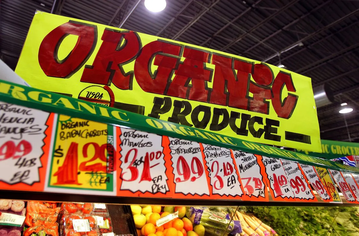 In a file photo, an "Organic Produce" sign hangs above produce pricing signage in the Shop & Save Market grocery store in Des Plaines, Illinois. (Tim Boyle/Getty Images)