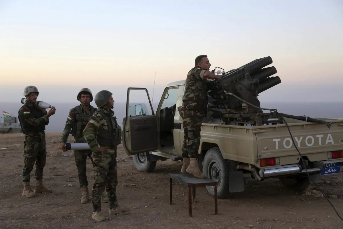 Kurdish security forces take up a position as they fight overlooking the ISIS-controlled in villages surrounding Mosul, in Khazer, about 30 kilometers (19 miles) east of Mosul, Iraq, on Oct. 17, 2016. (AP Photo)