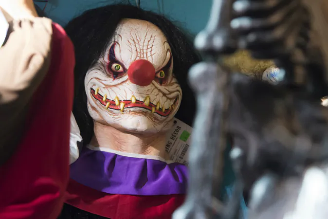 Halloween costumes and props, including a 'scary' clown mask, are seen for sale at Total Party, a party store, in Arlington, Virginia, October 7, 2016. Target removed clown masks from its stores and online retailer two weeks shy of Halloween on Oct. 16. (SAUL LOEB/AFP/Getty Images)