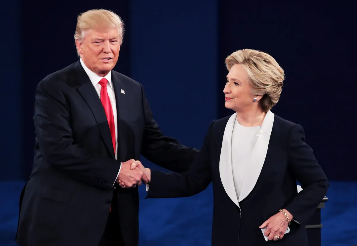Republican presidential nominee Donald Trump (L) shakes hands with Democratic presidential nominee Hillary Clinton during the town hall debate at Washington University in St. Louis, Mo., on Oct. 9, 2016. (Scott Olson/Getty Images)