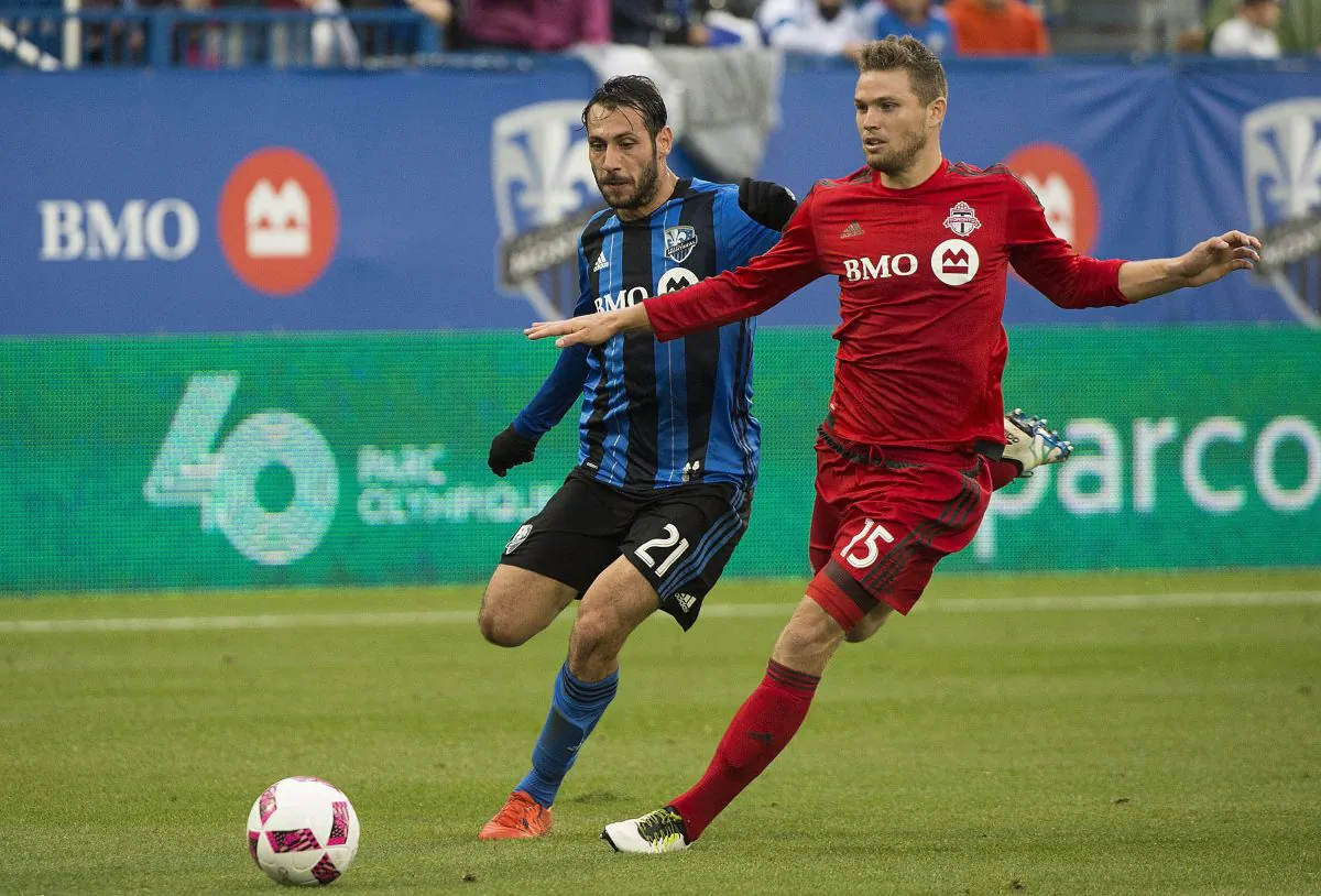Montreal’s Matteo Mancosu (L) challenges Toronto FC's Eriq Zavaleta in Montreal on Oct. 16, 2016. The Italian forward is head coach Mauro Biello’s preferred option over Didier Drogba to start Impact games. (The Canadian Press/Graham Hughes)