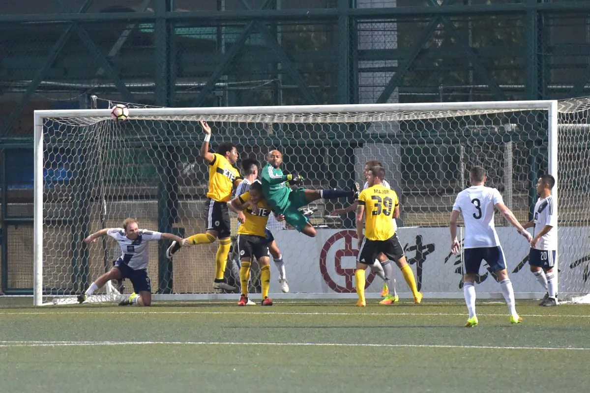 Action towards the end of the first half of the HKFA Premier match between HKFC and HK Pegasus at Sports Road on Friday Oct 14, 2016. (Bill Cox/Epoch Times)