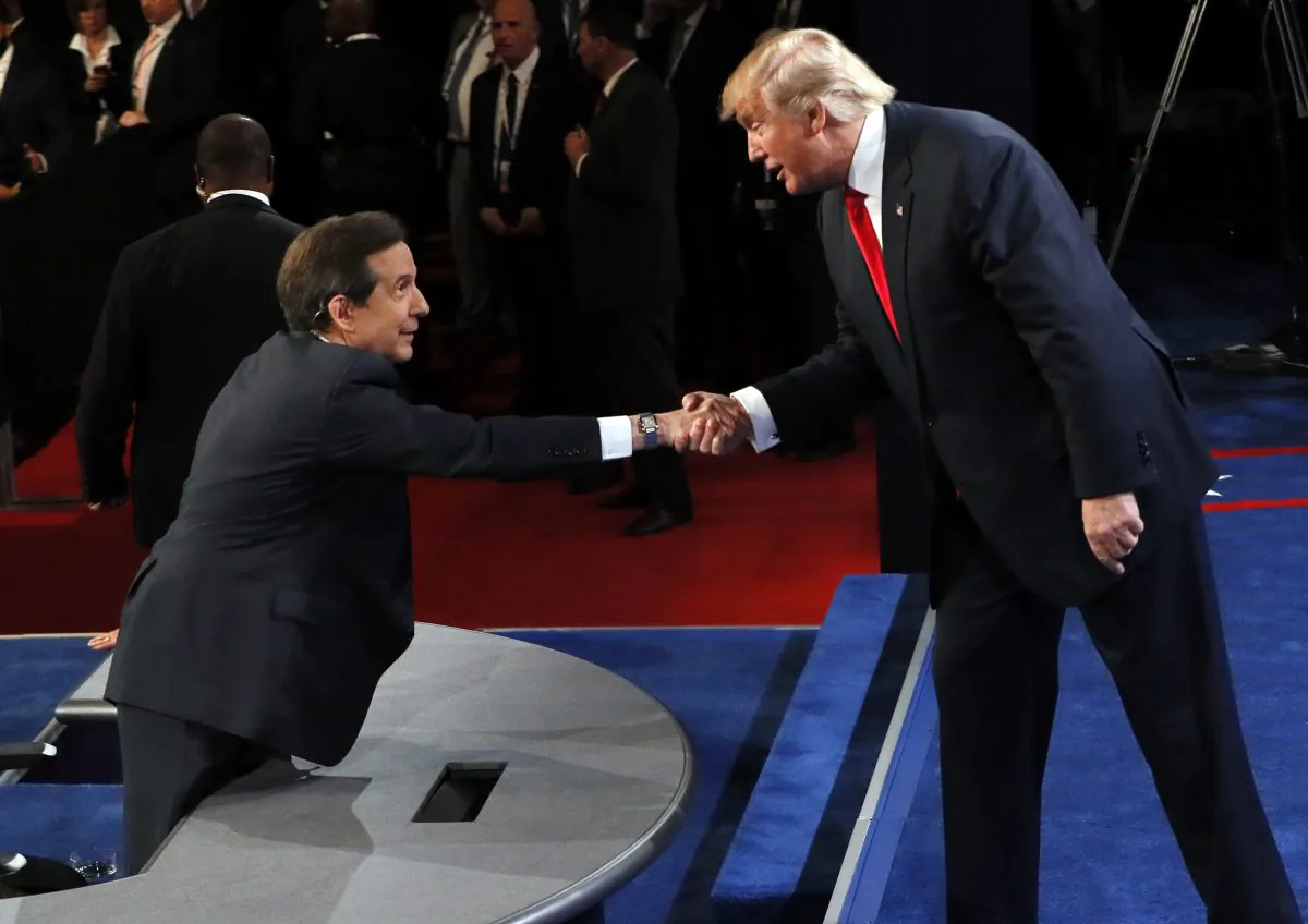 Republican presidential nominee Donald Trump shakes hands with moderator Chris Wallace, of FOX News, after the third presidential debate at UNLV in Las Vegas, on Oct. 19, 2016. (Mark Ralston/Pool via AP)