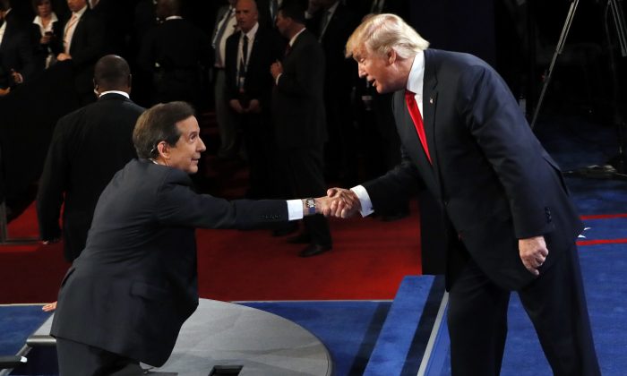 Republican presidential nominee Donald Trump shakes hands with moderator Chris Wallace, of FOX News, after the third presidential debate at UNLV in Las Vegas, on Oct. 19, 2016. (Mark Ralston/Pool via AP)