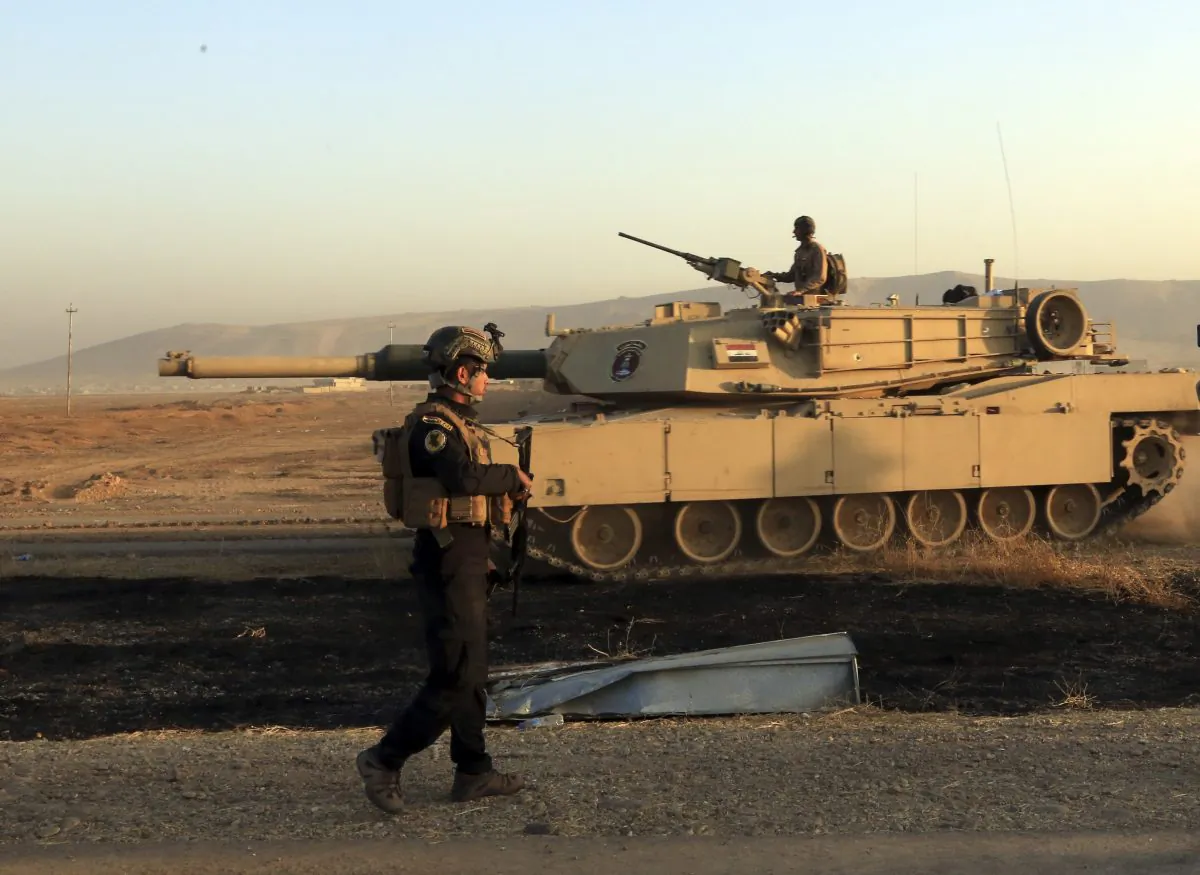 Iraq's elite counterterrorism forces advance near Mosul, Iraq, Thursday, Oct. 20, 2016.   Iraqi special forces charged into the Mosul battle Thursday with a pre-dawn advance on a nearby town held by the Islamic State group, a key part of a multi-pronged assault on eastern approaches to the besieged city.(AP Photo/Khalid Mohammed)
