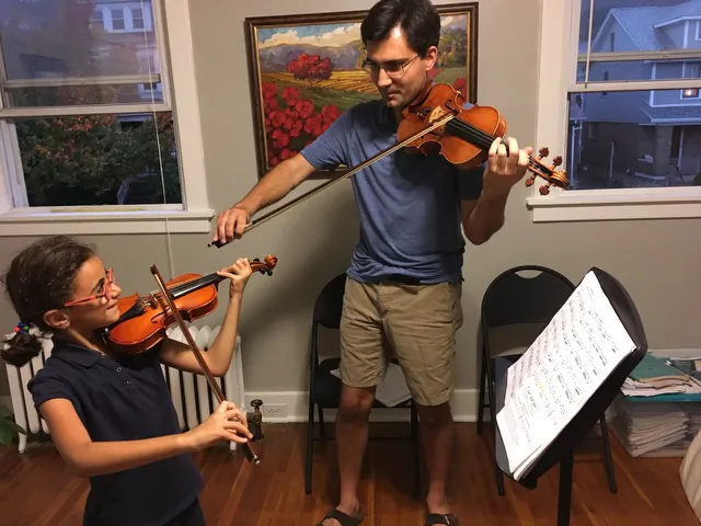 Devin Arrington with a student on Oct. 20 in his Pittsburgh home. (Courtesy of Devin Arrington)