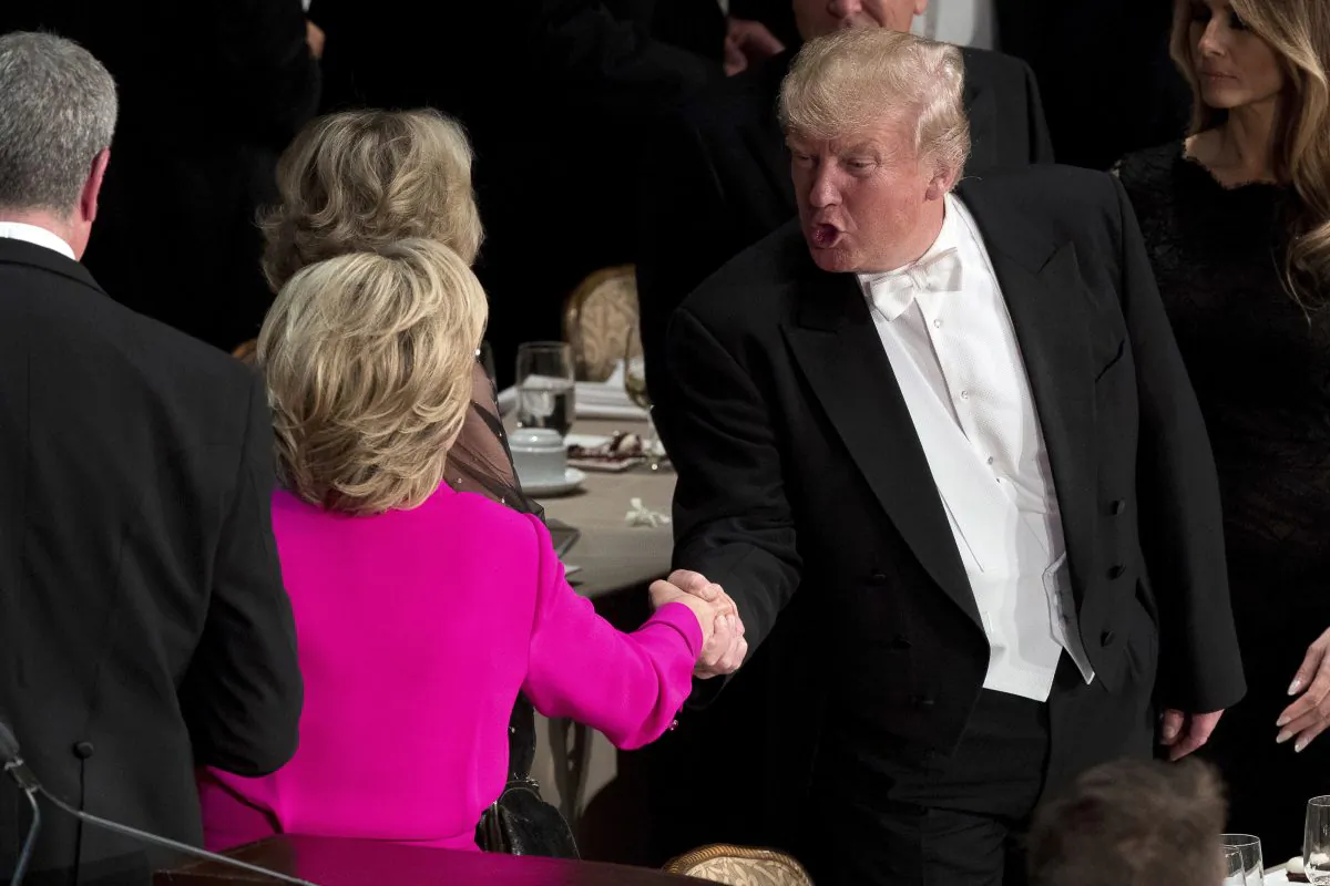 Republican presidential candidate Donald Trump (R) shakes hands with Democratic presidential candidate Hillary Clinton (L) at the conclusion of the 71st annual Alfred E. Smith Memorial Foundation Dinner, a charity gala organized by the Archdiocese of New York,  at the Waldorf Astoria hotel in New York, on, Oct. 20, 2016. (AP Photo/Andrew Harnik)