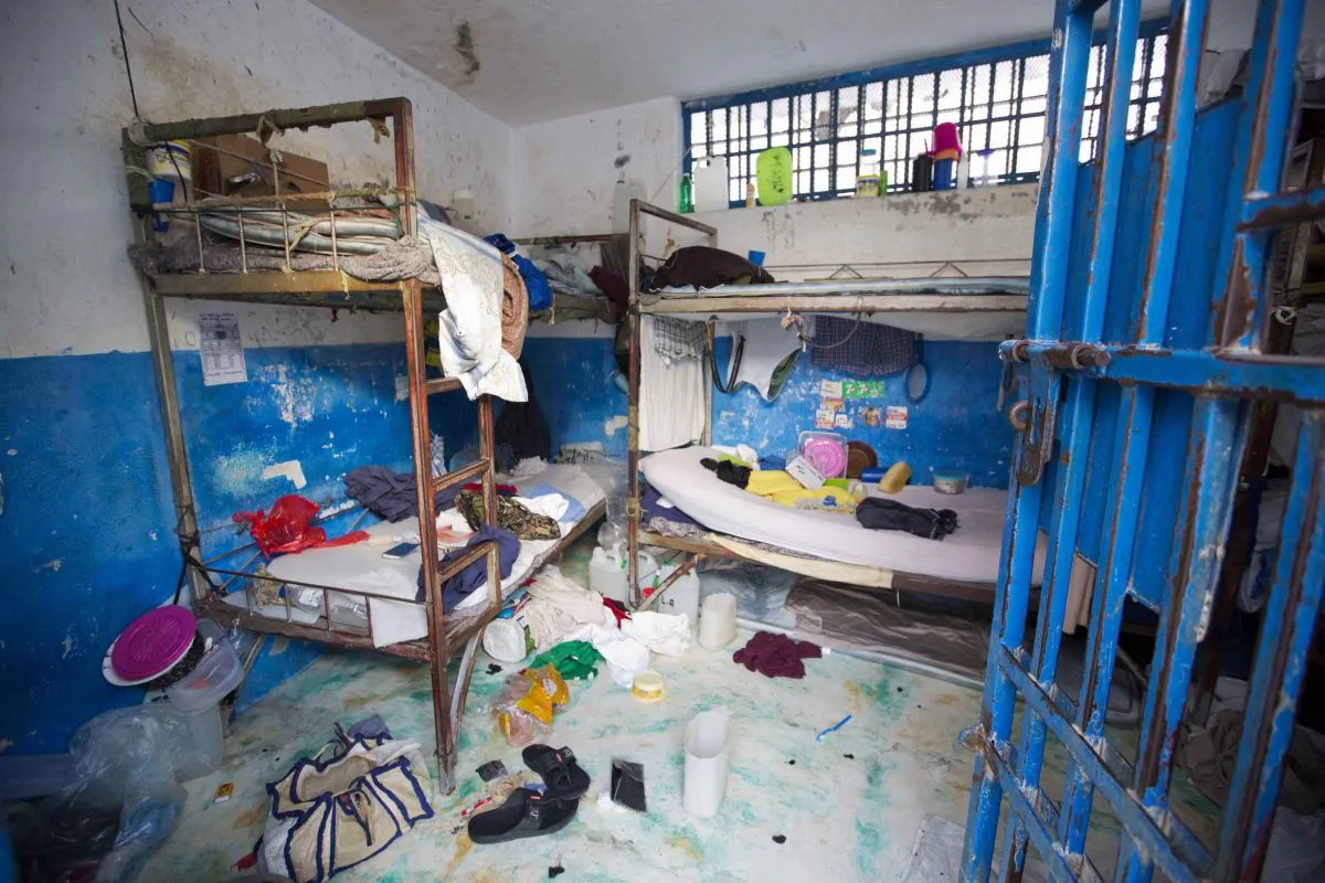 A prison cell is empty after inmates escaped from the Civil Prison in the coastal town of Arcahaiea, Haiti, on Oct. 22, 2016. (AP Photo/Dieu Nalio Chery)