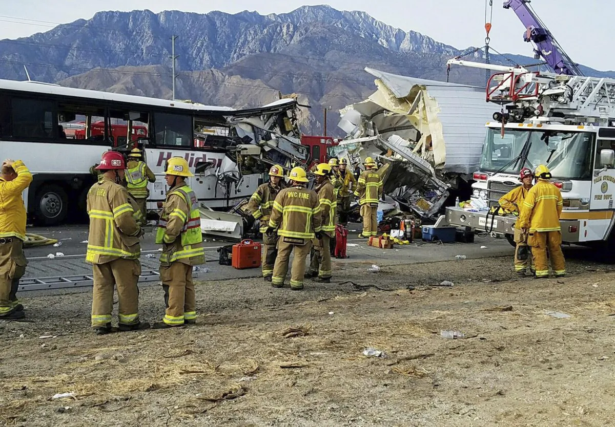 The scene of crash between a tour bus and a semi-truck crashed on Interstate 10 near Desert Hot Springs, near Palm Springs, in California's Mojave Desert on Oct. 23, 2016. (KMIR-TV via AP)