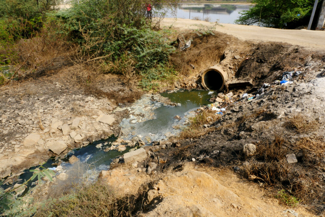 A file photo of a pipe discharging effluent from a factory that manufactures pharmaceuticals, owned by the company Aurobindo, in Bollaram, India. (Courtesy of Changing Markets)