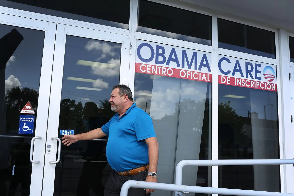 A person walks into the UniVista Insurance company office where people sign up for health care plans under the Affordable Care Act, also known as Obamacare, in Miami on Dec. 15, 2015. (Joe Raedle/Getty Images)