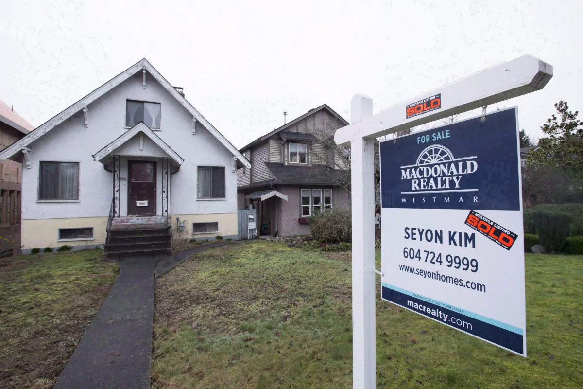 A home sold in Vancouver. The city’s skyrocketing housing market is another good reason for the federal government to reduce its appetite for mortgage insurance. (The Canadian Press/Jonathan Hayward)