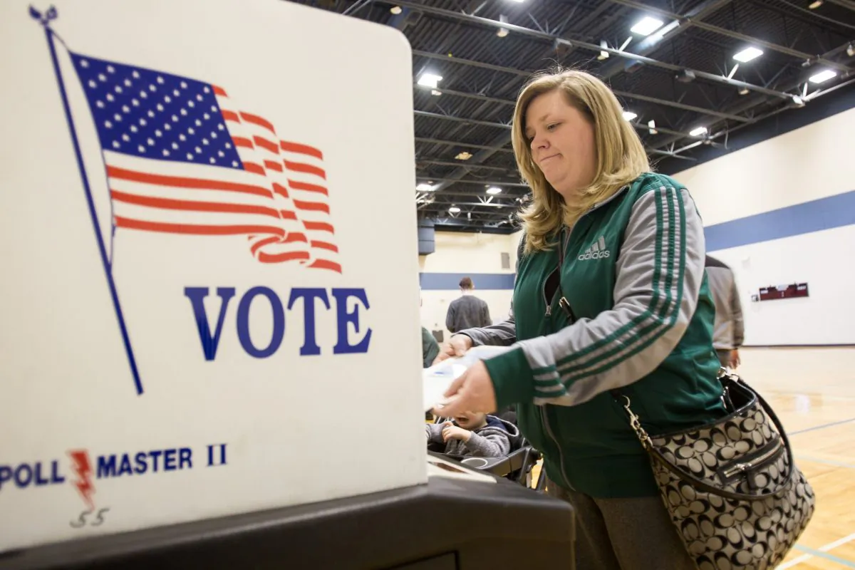A woman casts her ballot for the Michigan presidential primary at a polling station in Warren, Mich., on March 8, 2016.
(GEOFF ROBINS/AFP/Getty Images)