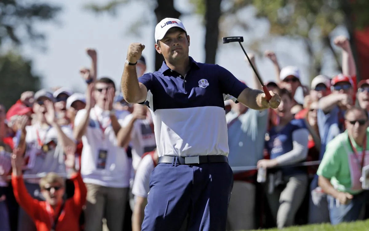 Patrick Reed reacts after winning the fifth hole during a singles match at the Ryder Cup golf tournament, at Hazeltine National Golf Club in Chaska, Minn. (AP Photo/David J. Phillip) 