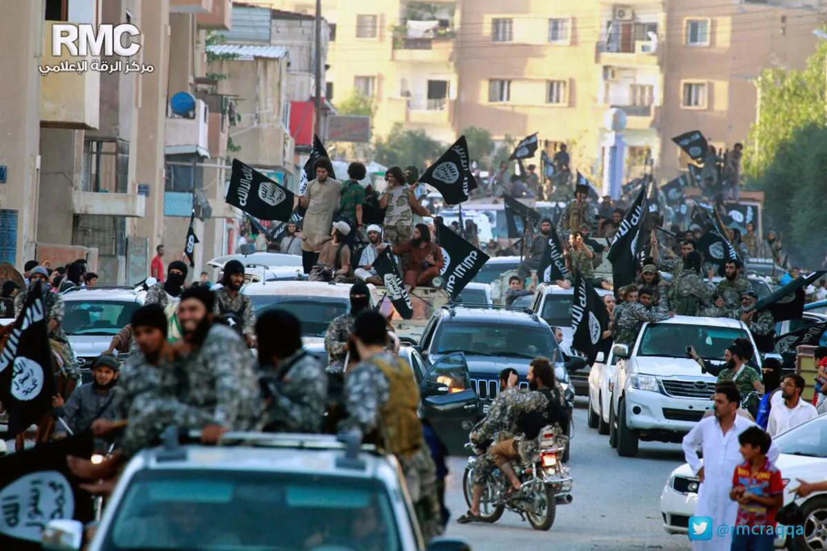 ISIS terrorists parade in Raqqa, Syria, which serves as their de facto capital, on
June 30, 2014.
(AP Photo/Raqqa Media Center of the Islamic State group)