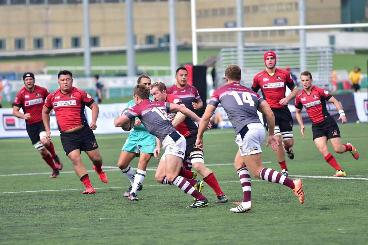 Kowloon take the play to Valley during their HKRU Premiership game at Happy Valley on Saturday Oct 29, 2016. Valley edged the match 24-18. (Bill Cox/Epoch Times)