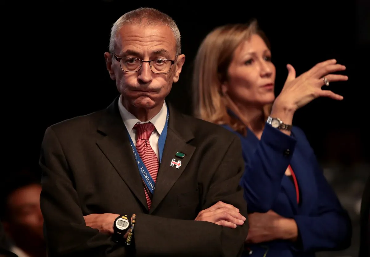 Democratic presidential nominee Hillary Clinton's Campaign Chairman John Podesta (L) looks on prior to the start of the Presidential Debate at Hofstra University in Hempstead, N.Y., on Sept. 26, 2016. (Drew Angerer/Getty Images)