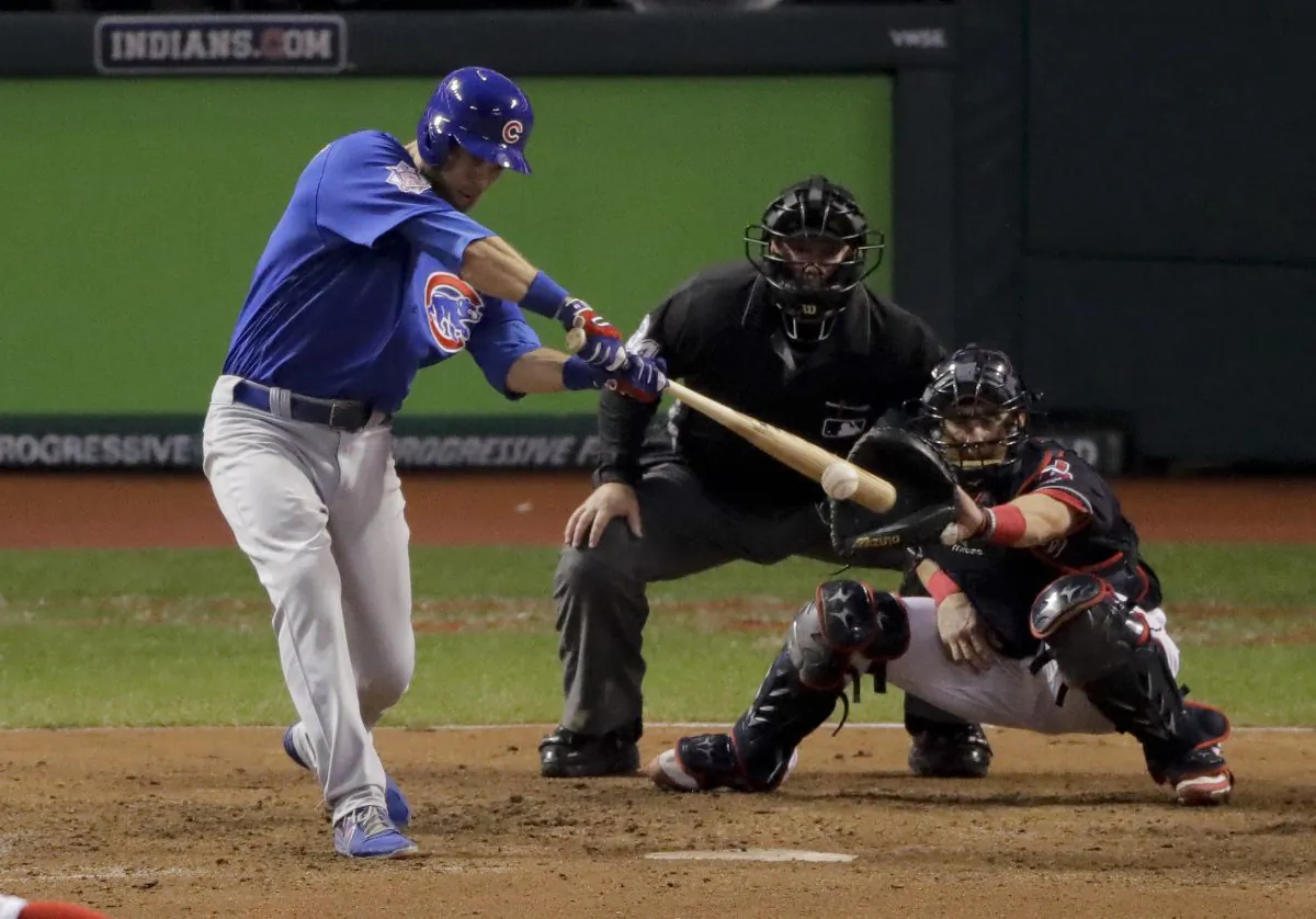 Chicago Cubs' Ben Zobrist watches his RBI-double against the Cleveland Indians during the 10th inning of Game 7 of the Major League Baseball World Series in Cleveland, on Nov. 3, 2016. (Charlie Riedel/AP Photo)