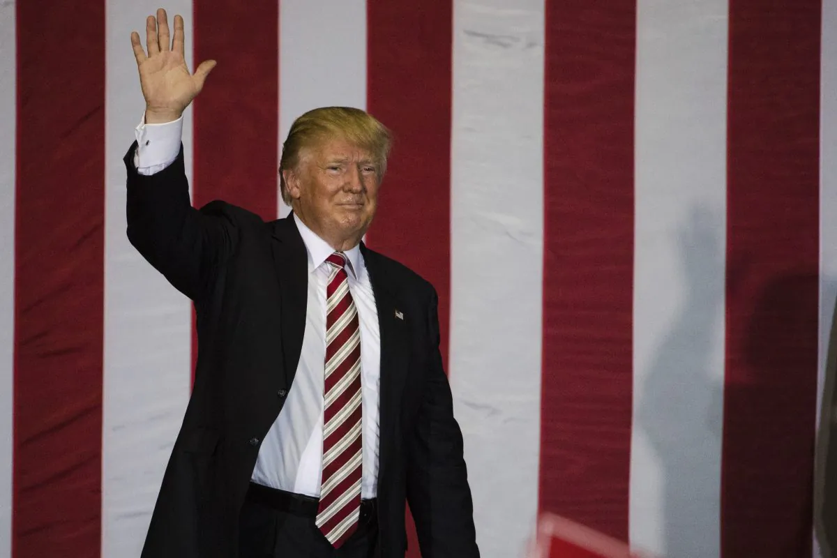 Republican presidential candidate Donald Trump waves during a campaign stop at the Jacksonville Equestrian Center in Jacksonville, Fla. on Nov. 3, 2016. (AP Photo/Matt Rourke)