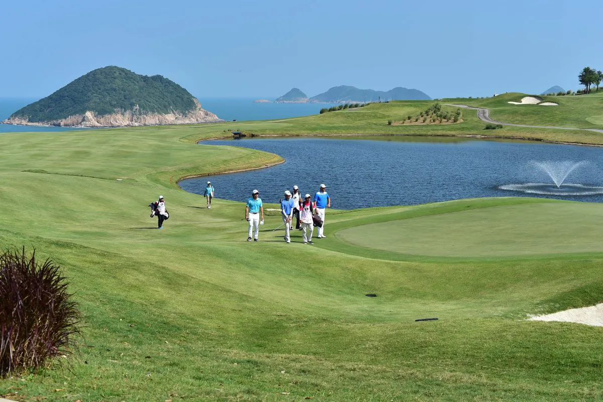 The lovely 7th hole at Clearwater Bay Golf Club, a par 4 which from the high tee position and a little breeze behind, most pros were able to drive over the water to the green on Day 2 of the PGA Tour China Series. (Bill Cox/Epoch Times)