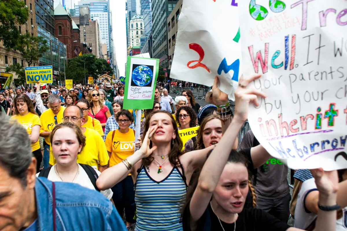 More than 300,000 people take part in the People's Climate Change march, considered to be the largest climate change march in history, in New York on Sept. 21, 2014. The emphasis on sustainability on college campuses. (Samira Bouaou/Epoch Times)