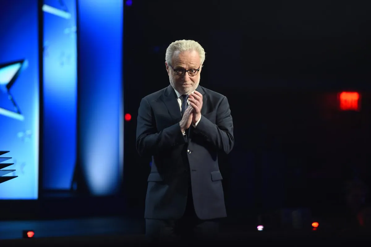TV Personality Wolf Blitzer appears on stage during Turner Upfront 2016 show at The Theater at Madison Square Garden in New York City on May 18, 2016. Emails leaked by WikiLeaks reveal the DNC colluding with CNN and Blitzer on question to ask Donald Trump. (Nicholas Hunt/Getty Images for Turner)