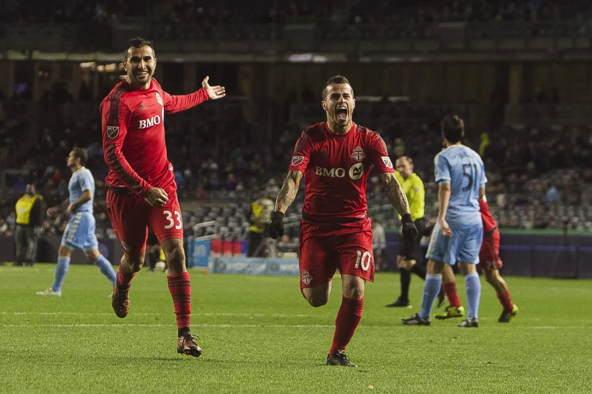Toronto FC’s Sebastian Giovinco celebrates after his goal against New York City FC in New York, on Nov. 6, 2016 as Steven Beitashour joins in to applaud the striker. (AP Photo/Andres Kudacki)
